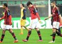 AC Milan players walk off following thier 1-0 defeat to Atletico Madrid