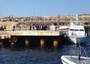 Papa arriva a Lampedusa su motovedetta